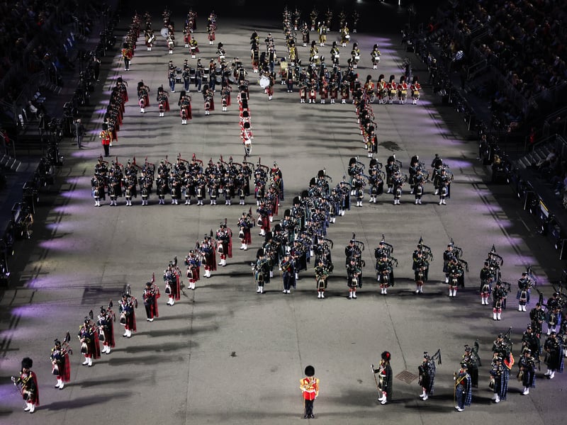 The Massed Pipes and Drums perform in a formation to mark the 75th year of the tattoo 