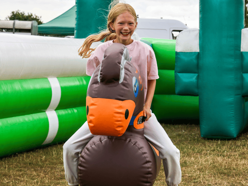 Children enjoying the bouncy rides.