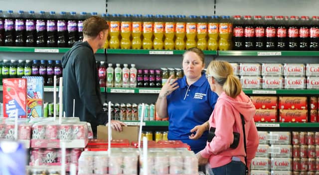 Staff welcome customers through the doors for the first time.