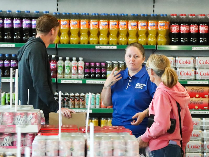 Staff welcome customers through the doors for the first time.