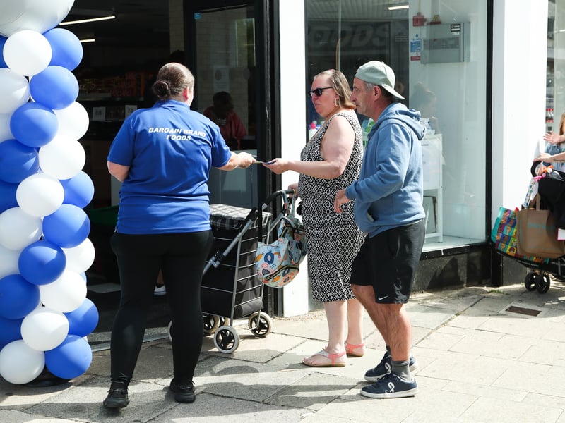 Bargain Brand Foods welcome some of the first customers through the door.