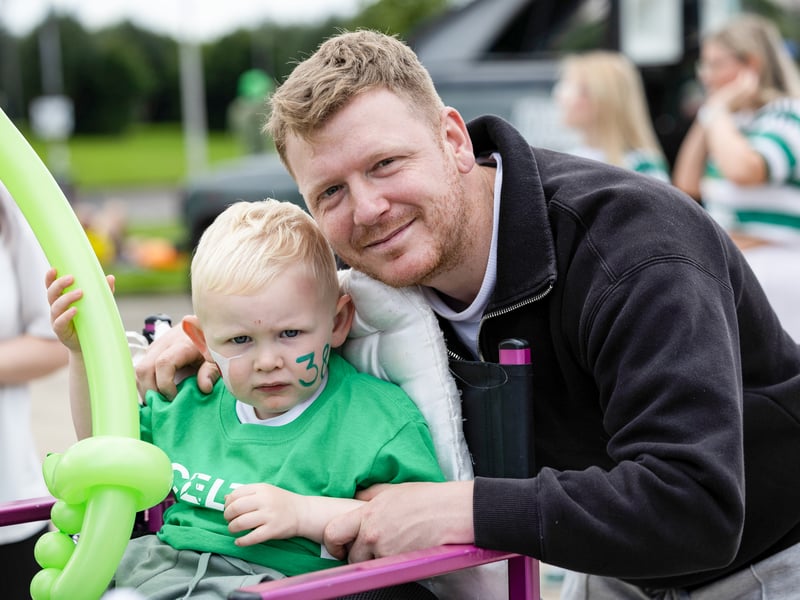 Celtic fans outside the stadium await the arrival of the team.