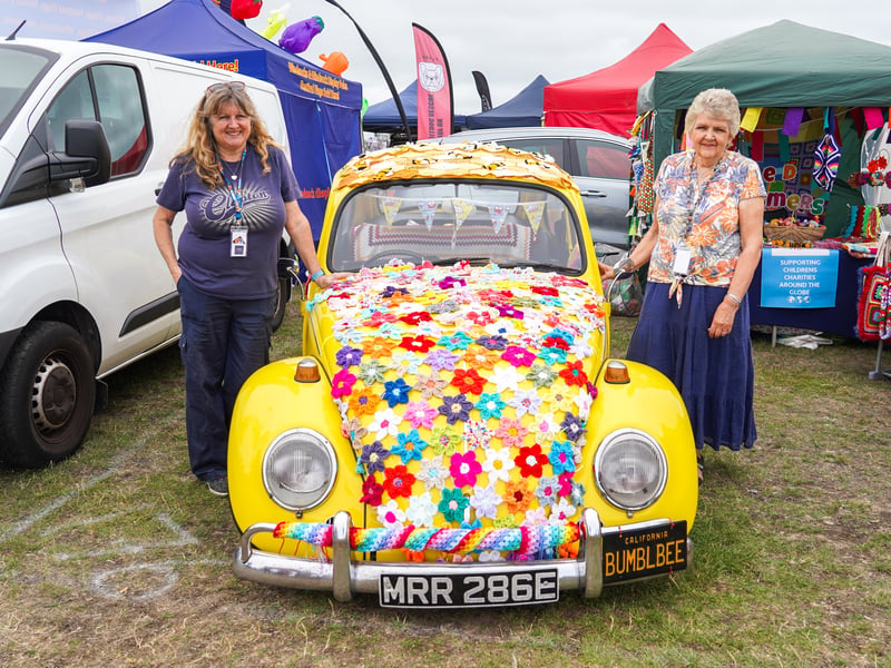 Tina Smith and Annette Lambert of the Seeded Yarn Stormers stood next to a yellow Beetle at the Beach Dubbin festival on Southsea Common in Portsmouth. 

Picture: Alec Chapman