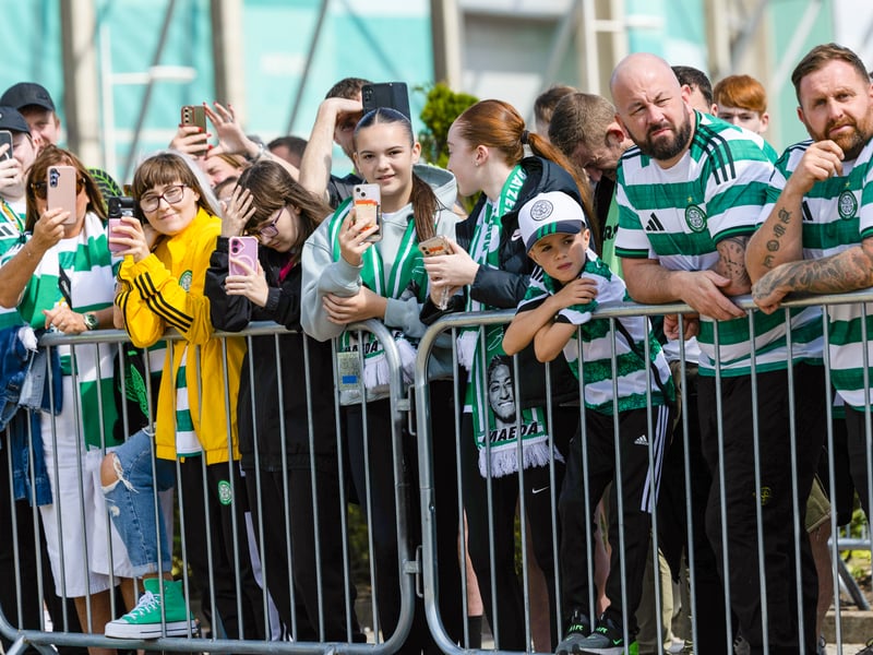 Supporters ensure they get a photo of the team coach arriving as they celebrate Celtic's Flag Day against St Mirren.