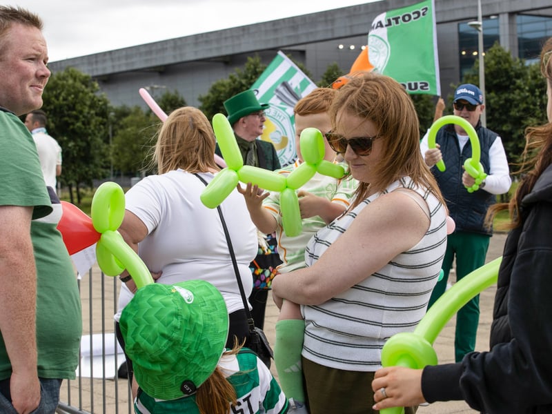 The fans await the team coach arriving on Celtic Way.