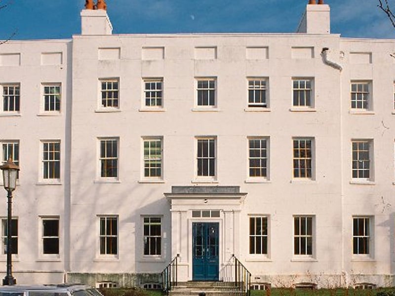 The Parade is a Terrace of dockyard officers' lodgings - 1715-19. It was partially converted to office use in 1995, but is now empty. Prone to wet rot and some structural movement, the site has persisting structural and drainage problems between the main building and the rear extensions. There is extensive decay in the panelling and some plaster ceilings have collapsed. An extensive programme of repair is underway and the roof has been reslated and the gutters repaired. Render and window joinery repairs are also underway as well as the repair of the timber porches. Further works to the rear extensions are planned. It has been given a priority grade of F - as repair work is underway - and is in fair condition.