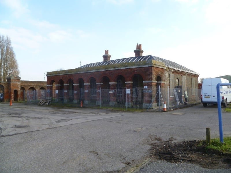 The Former Guard House to Gunboat Yard was constructed in the mid-19th century, mainly built of red brick with limestone dressings beneath a hipped slate roof. Vacant and at risk due to poor condition of roofs, rainwater disposal, leaning chimney stack, windows, doors, floors and internal finishes. Historic England grant aided a Conservation Management Plan and Feasibility Study. New uses are being explored. It has been given a priority C grade and is suffering from "slow decay".