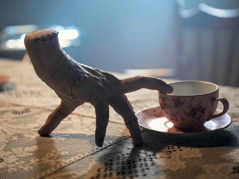 Thing is back for season two of Wednesday. The hand is played by Romanian magician Victor Dorobantu.
