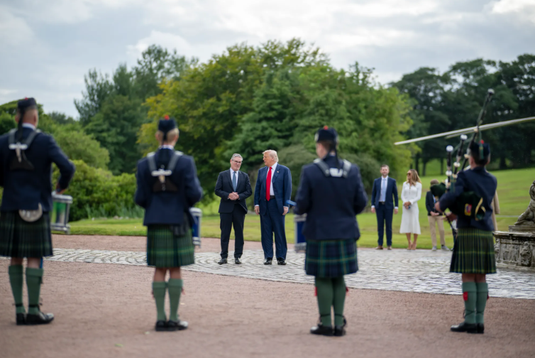 A pipe band from Robert Gordon's College greeted the president and prime minister.