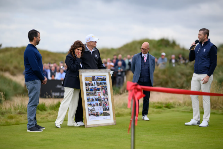 The US president cut the red ribbon to a loud applause and opened his new golf course at his Balmedie estate.