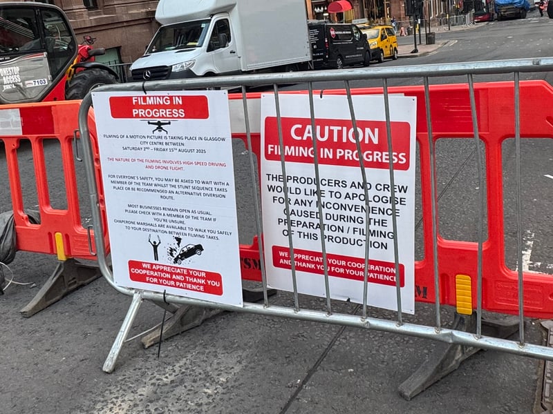 Signs warning pedestrians about the filming.