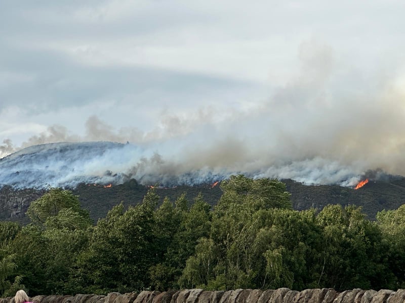 The fire is spreading rapidly from the top of Arthur's Seat down the hillside.