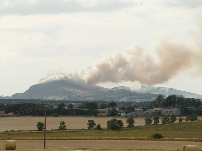 The thick smoke can be seen for miles coming from the top of the famous Edinburgh landmark.