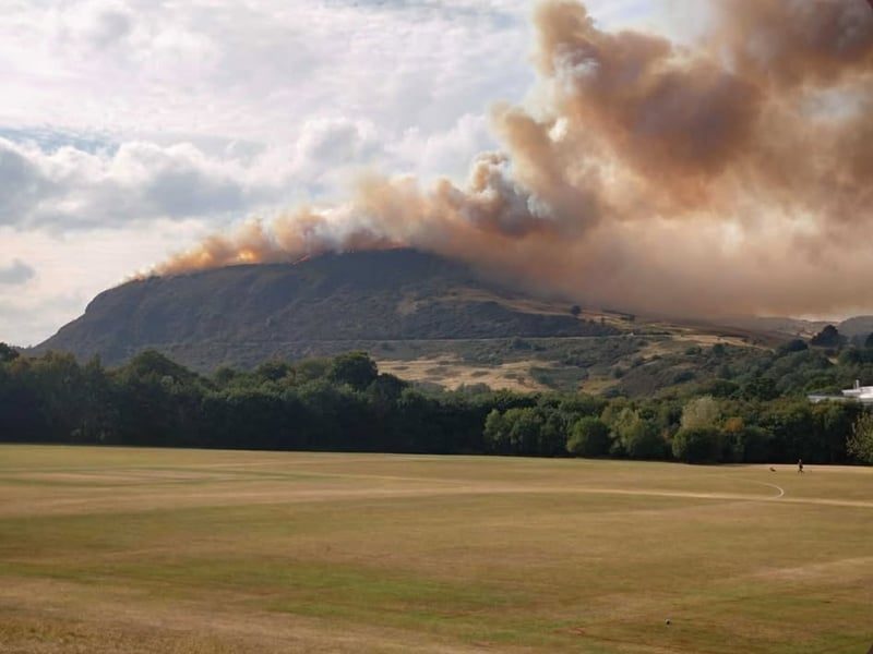 The sky above Arthur's Seat is filled with thick smoke as fire crews battle the blaze.