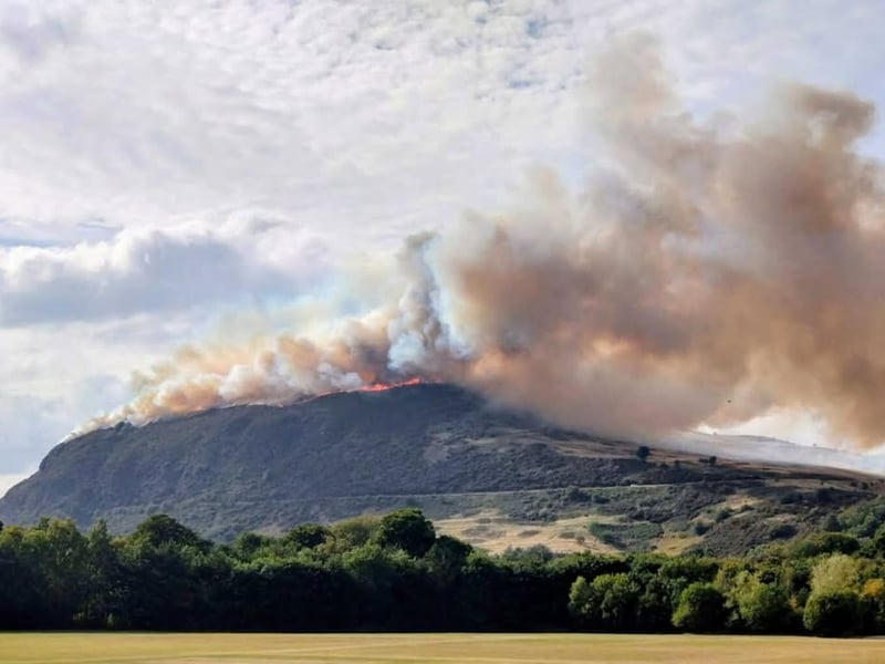Flames can be seen spreading on the top of Arthur's Seat and down the hillside.