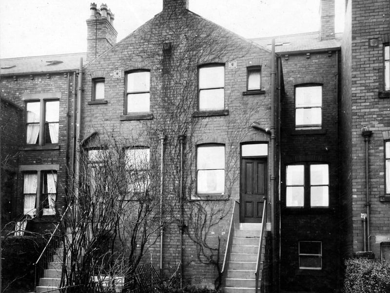 Kitchens and bathrooms project out from the rear of property on Austhorpe Road. The steps go to the back doors of number 124 Austhorpe Road to the left and number 126 Austhorpe Road to the right. Pictured in November 1929.
