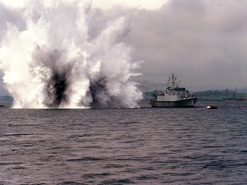 HMS Pembroke, a former Sandown-class minehunter, carried out various operations for the UK before she was retired in 2023. She has since been sold to the Romanian Navy and renamed Căpitan Constantin Dumitrescu. Pictured is the ship destroying a mine.