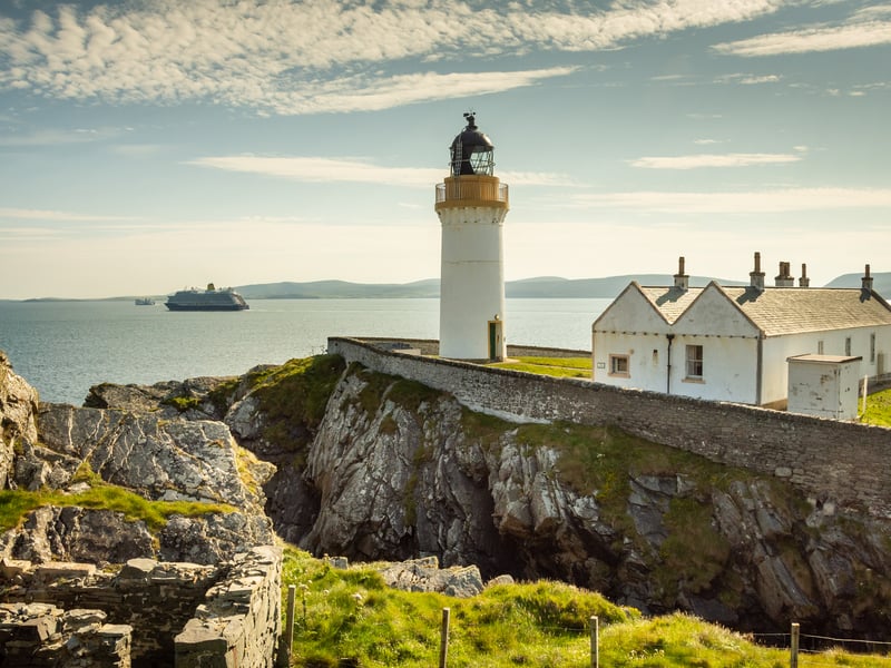The lighthouse is located at Kirkabister Ness, on the southwestern tip of the island of Bressay, in Shetland