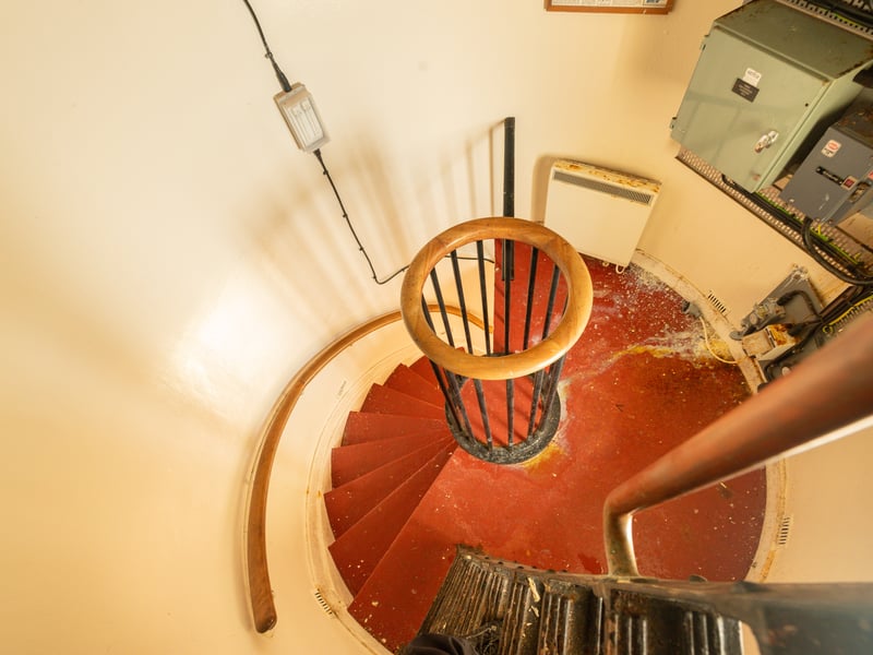 A spiral staircase leads up to the top of the lighthouse