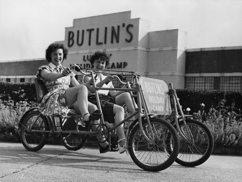 Holidaymakers riding a bicycle for two at Butlin's Holiday Camp in Clacton in 1950