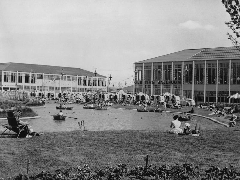 Holidaymakers on and beside the boating lake at Butlin's in Minehead, Somerset, in around 1964
