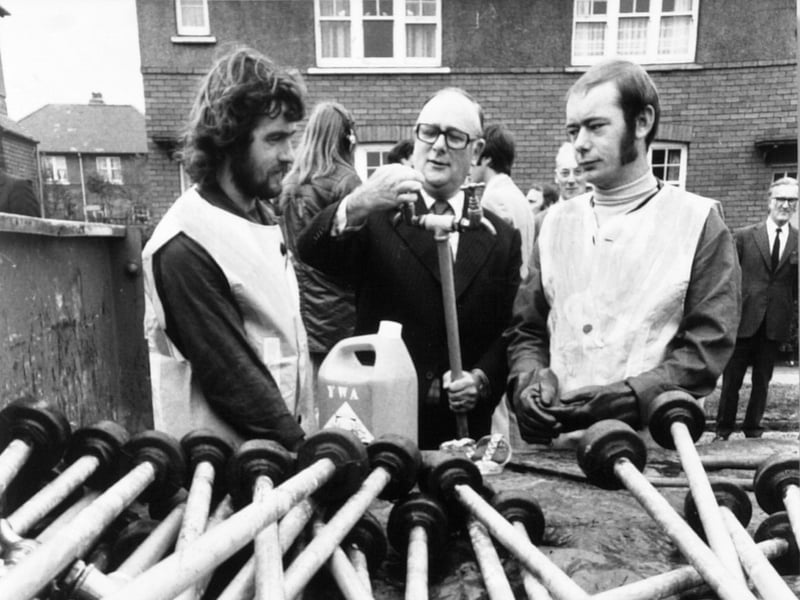 Denis Howell with workmen erecting standpipes in Wakefield during the drought in September 1976