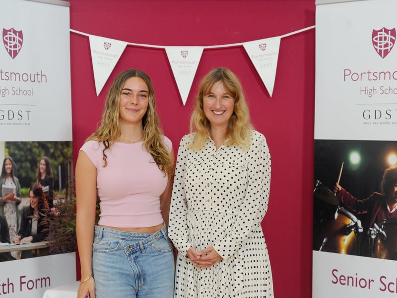 Students from Portsmouth High School in Southsea, collected their A Level results.

Pictured is: Head girl Katie Cells (18) who got 2 A*'s in Biology and Geography and an A in Chemistry, with the Head of Portsmouth High School Sarah Parker.

Picture: Sarah Standing (140825-2955)