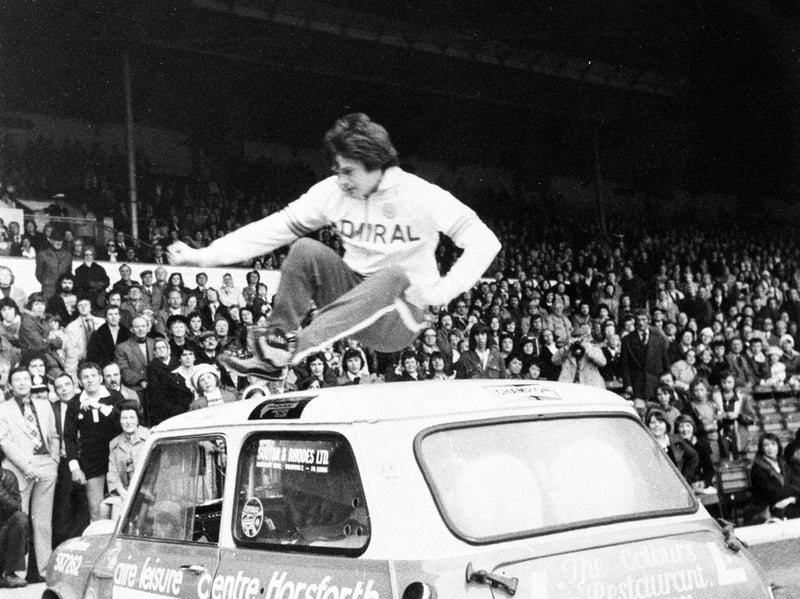 The first public performance of Leeds United star Duncan McKenzie's 'party piece' of leaping over a Mini car is seen at Elland Road before the Paul Reaney testimonial game in May 1976