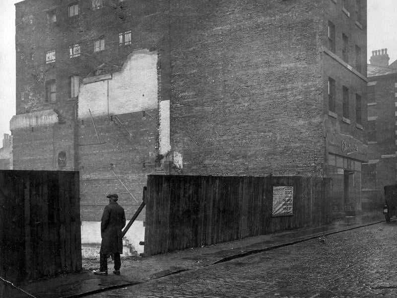 Waste Land on Albion Street, next to Electricity Showrooms. Upper Fountain Street can just be seen to right of picture. Man standing looking at derelict land. Pictured in November 1929.