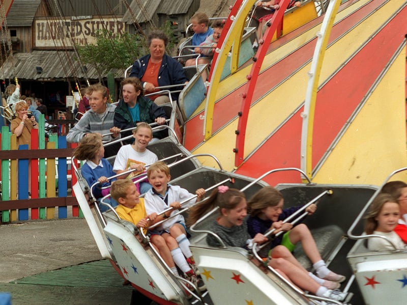 Delight is etched upon children's faces as they enjoy a ride at the old Frontierland theme park, in Morecambe, in April 1998