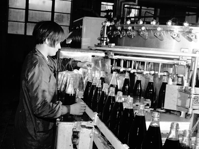 A woman working at Hendry's soft drinks bottling plant on Lower London Road, Edinburgh, in September 1970
