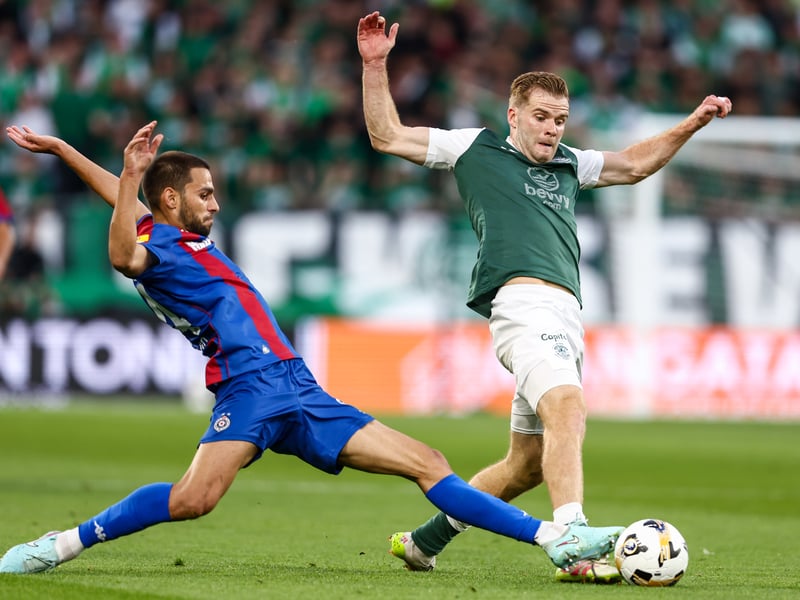 Chris Cadden challenges for the ball with Partizan's Mario Jurcevic.