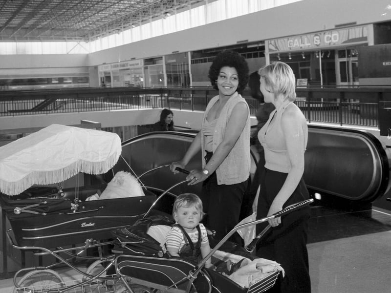 Mrs Wharton and Mrs Campbell with prams at the escalator of the Wester Hailes shopping centre, newly opened in June 1974