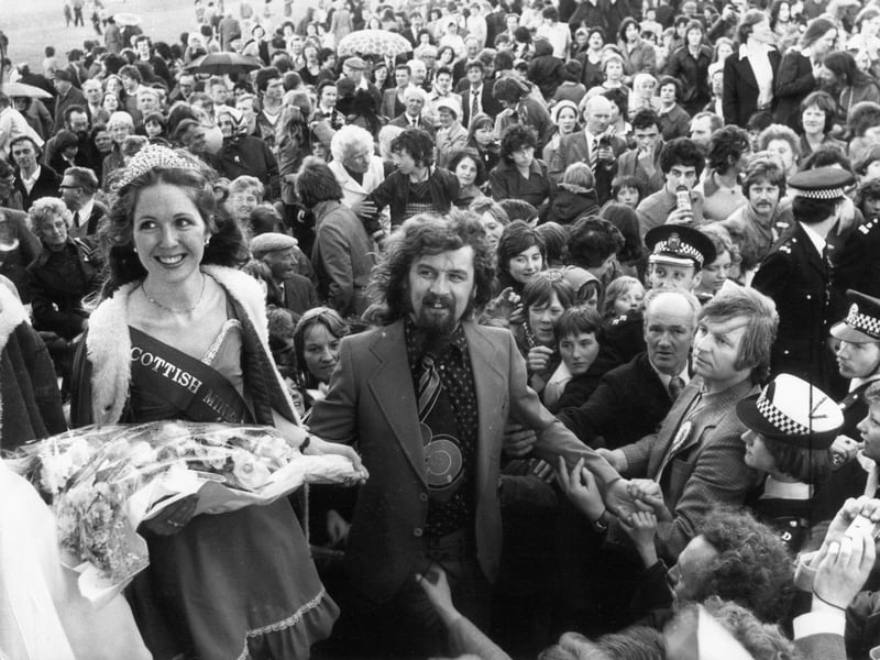 Comedian Billy Connolly pictured with the Scottish Coal Queen Miss Sandra Carruthers, of Cumnock, during the heyday of the Scottish Miners' Gala in Edinburgh, on June 12, 1976