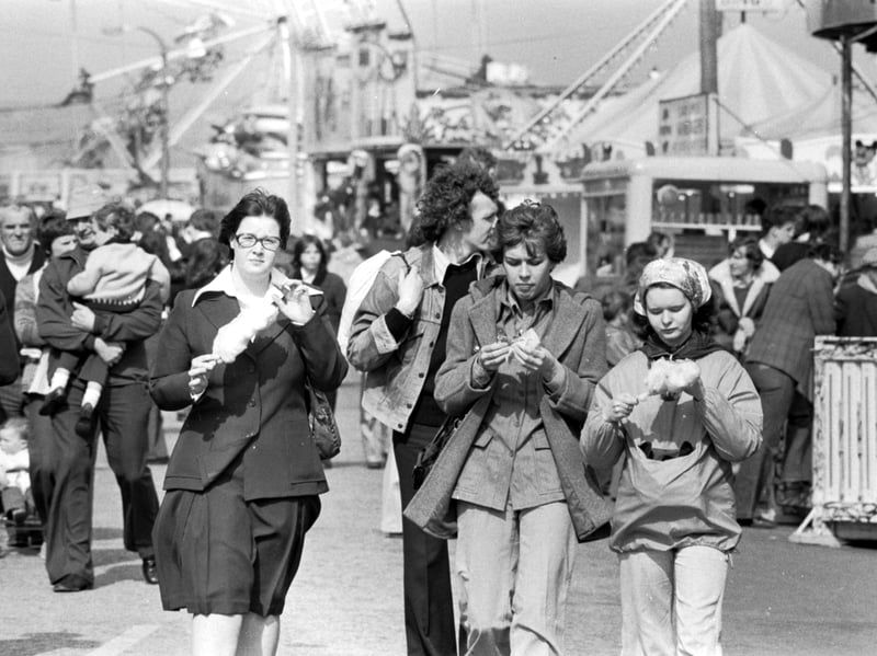 Youngsters enjoy the Easter sunshine and candy floss at the Links Market funfair in Kirkcaldy, Fife, in April 1976