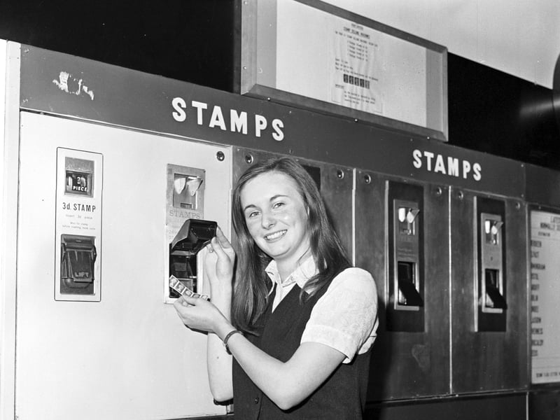 Elizabeth Byers tries out the new stamp machines which work with decimal coins, at the GPO in Edinburgh in September 1970