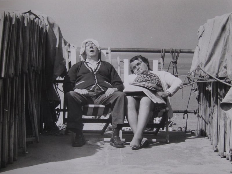 A couple dozing at Blackpool seafront in 1974