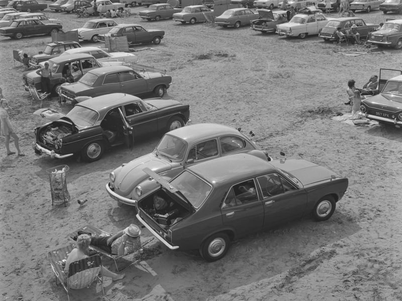 Holidaymakers stay by their cars on the beach at Weston-super-Mare, Somerset, in August 1973