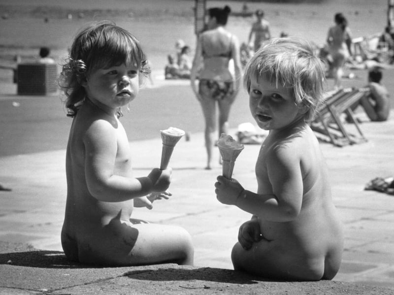 A couple of youngsters enjoy ice creams on the beach in 1976