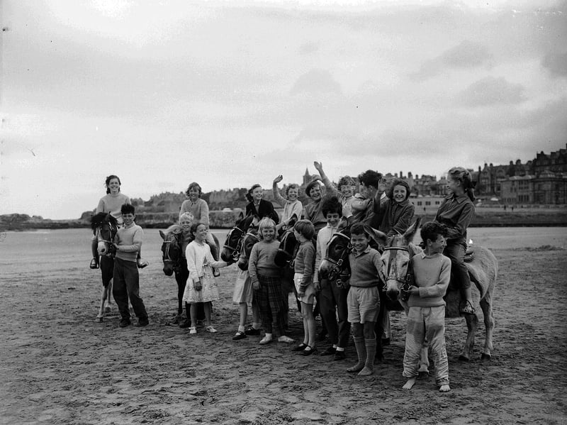 Holiday-makers with the donkeys at St Andrews beach, Fife, in 1961