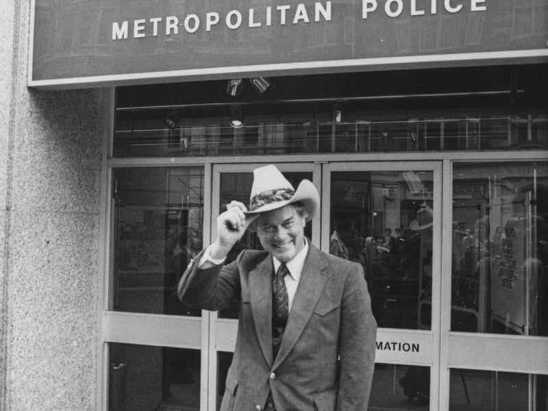 Actor Larry Hagman, who starred as J.R. Ewing in the hit 80s soap opera Dallas, pictured in character outside the headquarters of the Metropolitan Police in June 1980