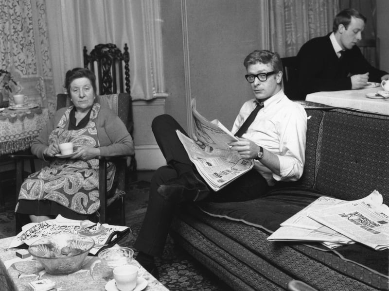 Sir Michael Caine, whose real name is Maurice Micklewhite, is pictured here in February 1964, aged 30, at home with his mother Ellen and brother Stanley. He made his acting debut in 1950 and became a regular on stage, radio and TV before his role in the 1964 film Zulu catapulted him to stardom. His impressive CV includes leading roles in the films Alfie, Get Carter, Educating Rita and The Quiet American, and he has won two Oscars for best supporting actor.