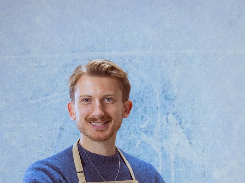 31-year-old Tom grew up in London and is a creative entrepreneur. As a teen, Tom feared his secret love of baking would out him. Now, a member of two queer sports teams and with a boyfriend of three years, the game may be up. Tom grew up in a food obsessed family and when not working you can find him fishing for Sea Bass with his brother, foraging for mushrooms and cooking roasts with his dad.
