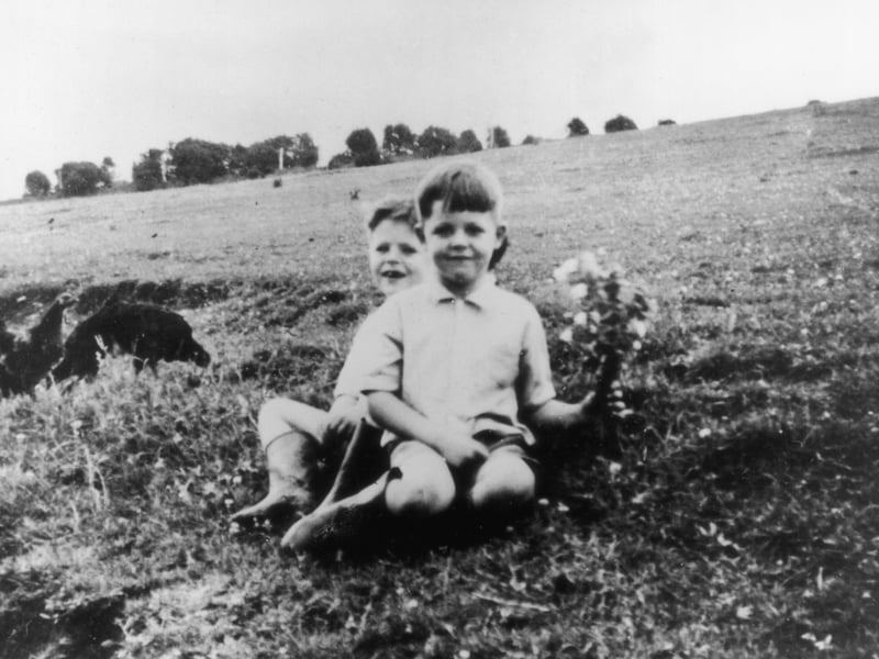 Sir Paul McCartney is pictured here in 1948, aged six, with his eight-year-old brother, Mike. He taught himself to play the piano and guitar as a teenager and was just 15 when he joined John Lennon's skiffle group, the Quarrymen, in 1957. Three years later, that band would become the Beatles, who exploded onto the charts in 1962, with their first hit, Love Me Do.