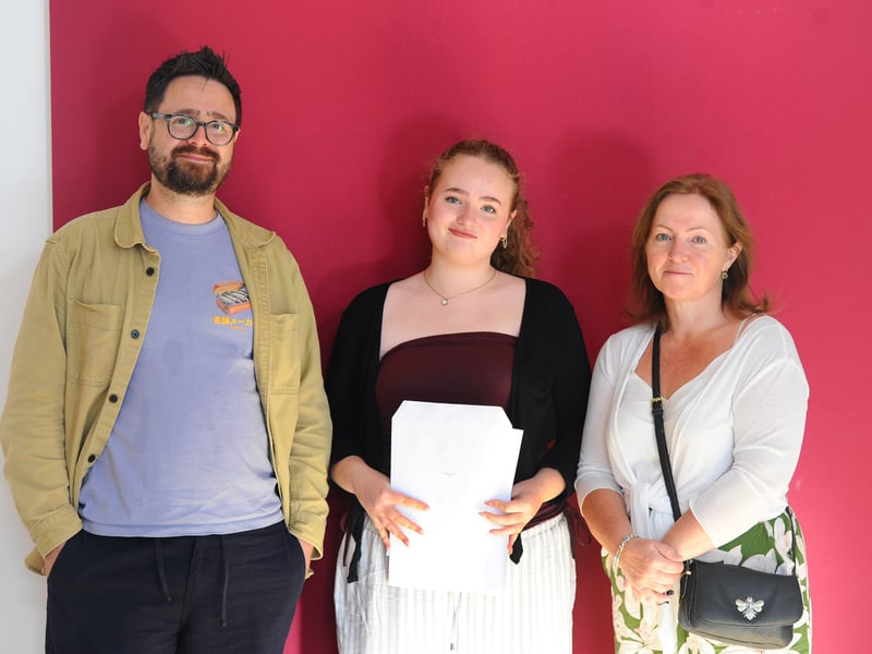 Students from Portsmouth High School in Kent Road, Southsea, collected their GCSE results. 

Pictured is: Freyja (16) with her mum and dad Rob and Jo. Picture: Sarah Standing (210825-3028)