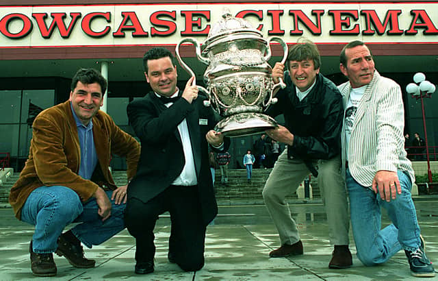 May 1997 and Showcase Cinema manager Fred Booth, second from left is presented with a trophy for the successful run of Brassed Off by stars of the film, from left Jim Carter , Phillip Jackson and Pete Postlethwaite.