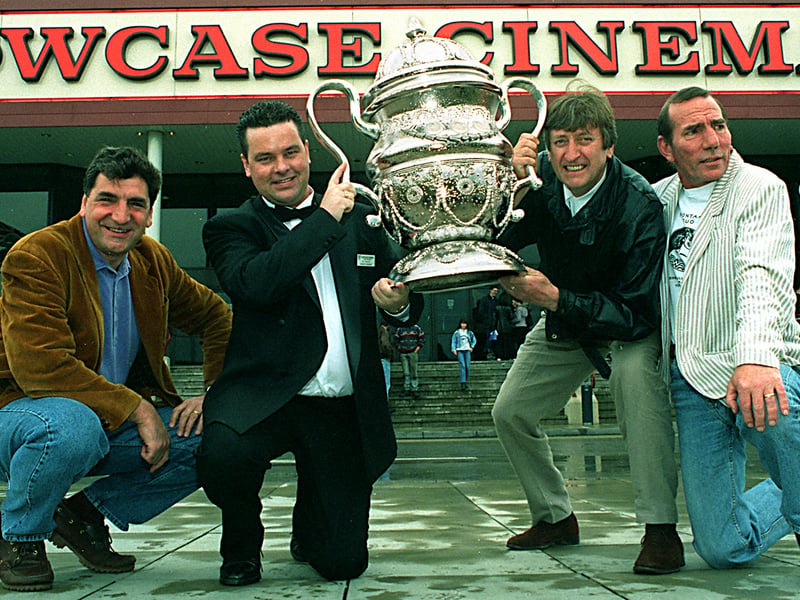 May 1997 and Showcase Cinema manager Fred Booth, second from left  is presented with a trophy for the successful run of  Brassed Off by stars of the film, from left Jim Carter , Phillip Jackson and Pete Postlethwaite.