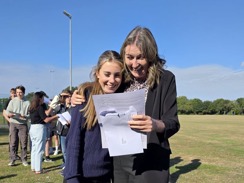 Students from King's Academy Brune Park in Gosport, collected their GCSE results this morning. 

Pictured is: Edie Hensman (16) who secured a Grade 7 in English Literature, Grade 6 in History, Grade 5 in English Language, Art and Combined Science as well as a 4 in Maths Higher and Sociology with headteacher Kerry Payne.