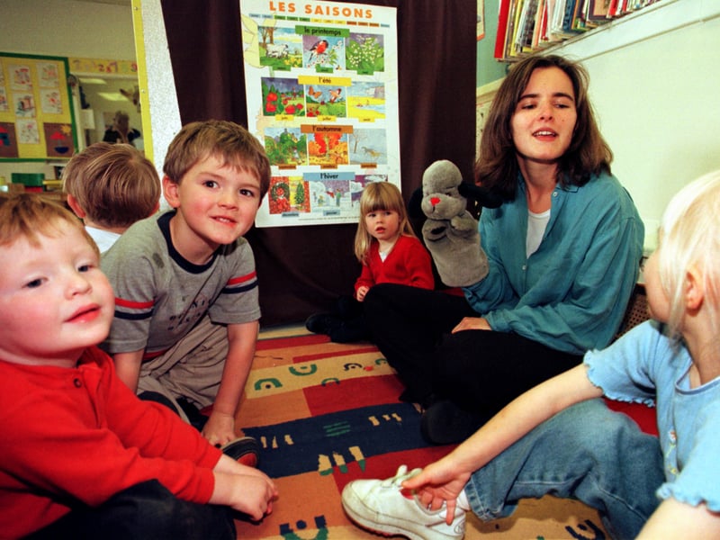 Teacher Elise Gay pictured with children at Little Acorn Nursery in September 1999
