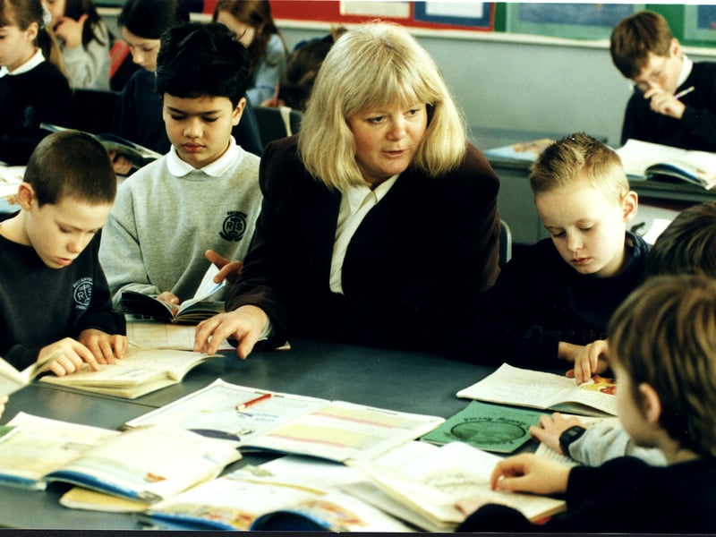 Wendy Haywood, headteacher at Riccarton Primary School, Edinburgh, sitting with pupils in 1997